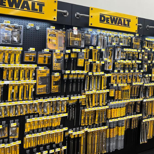 Display of DEWALT hand tools and accessories, mainly focusing on our selection of drill bits. All neatly organized on our store wall.